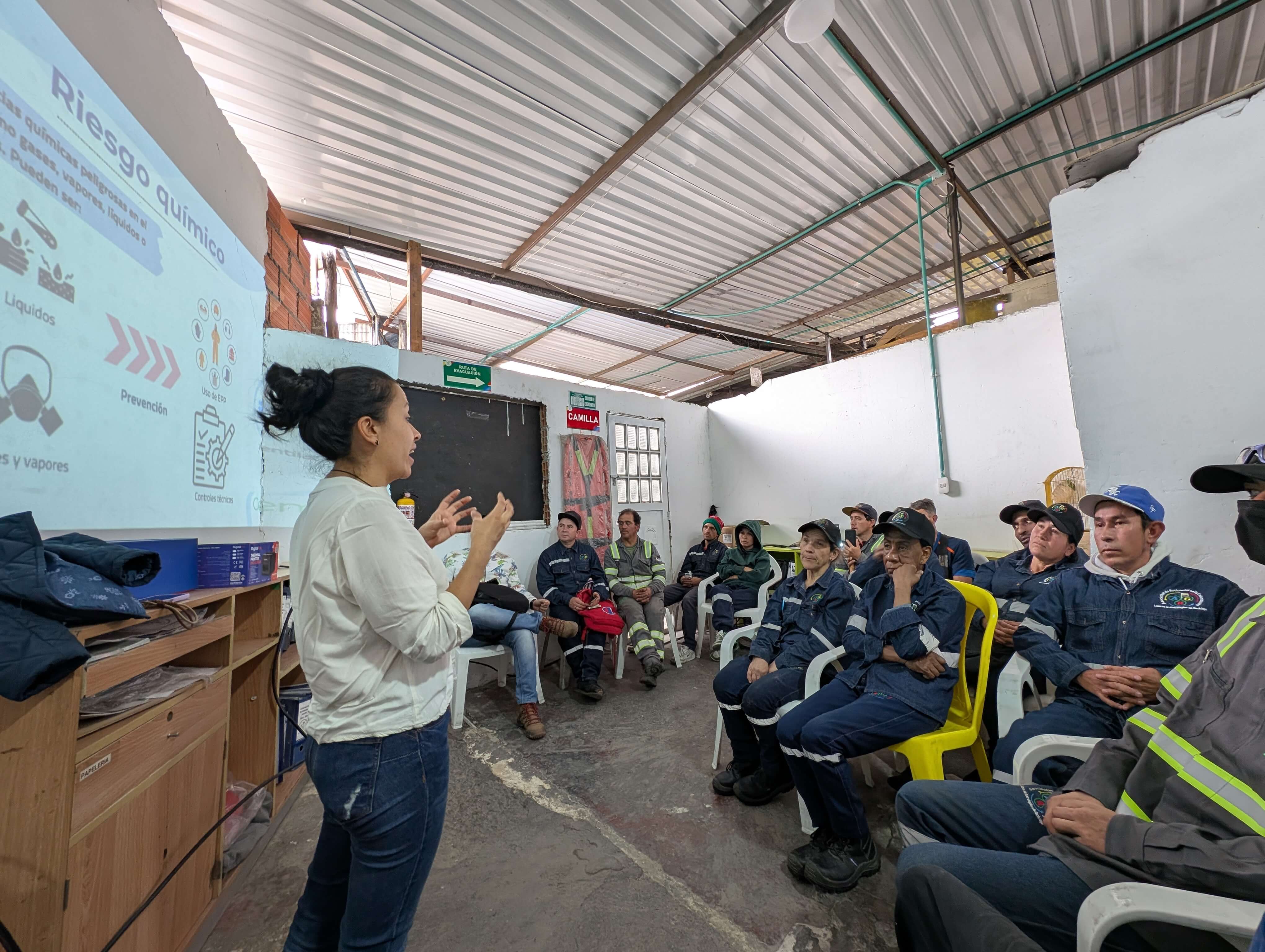 Training participants sit facing a screen.
