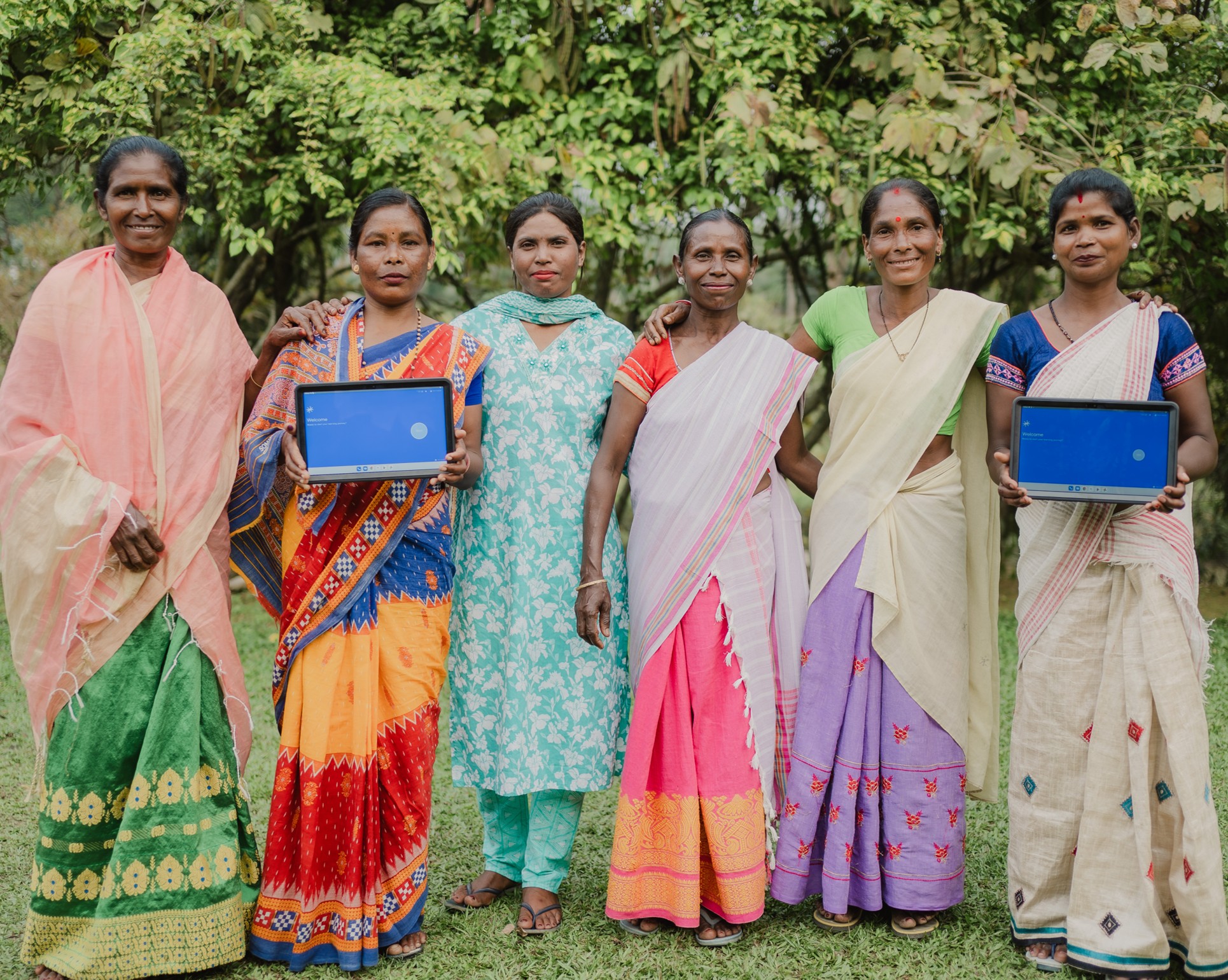 Rainforest Alliance project on using gamified technology with farm workers, six women pictured with tablets of the training