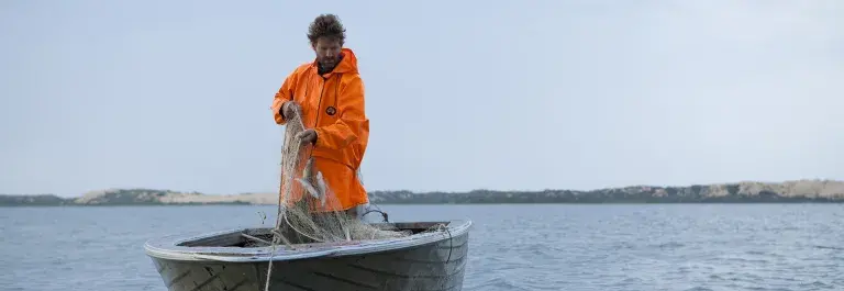 Man skipper fishing on the water in Australia © Randy Larcombe, MSC