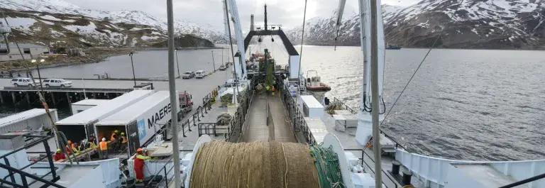 Alaskan pollock ship with large rope coil and snowy mountains in the background © Mark Meyer for MSC