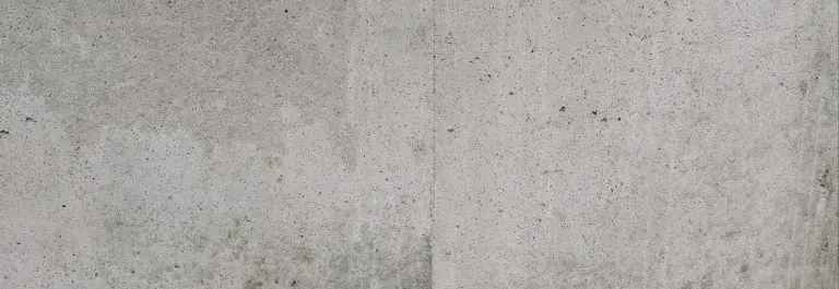 Close-up view of a rough textured concrete wall