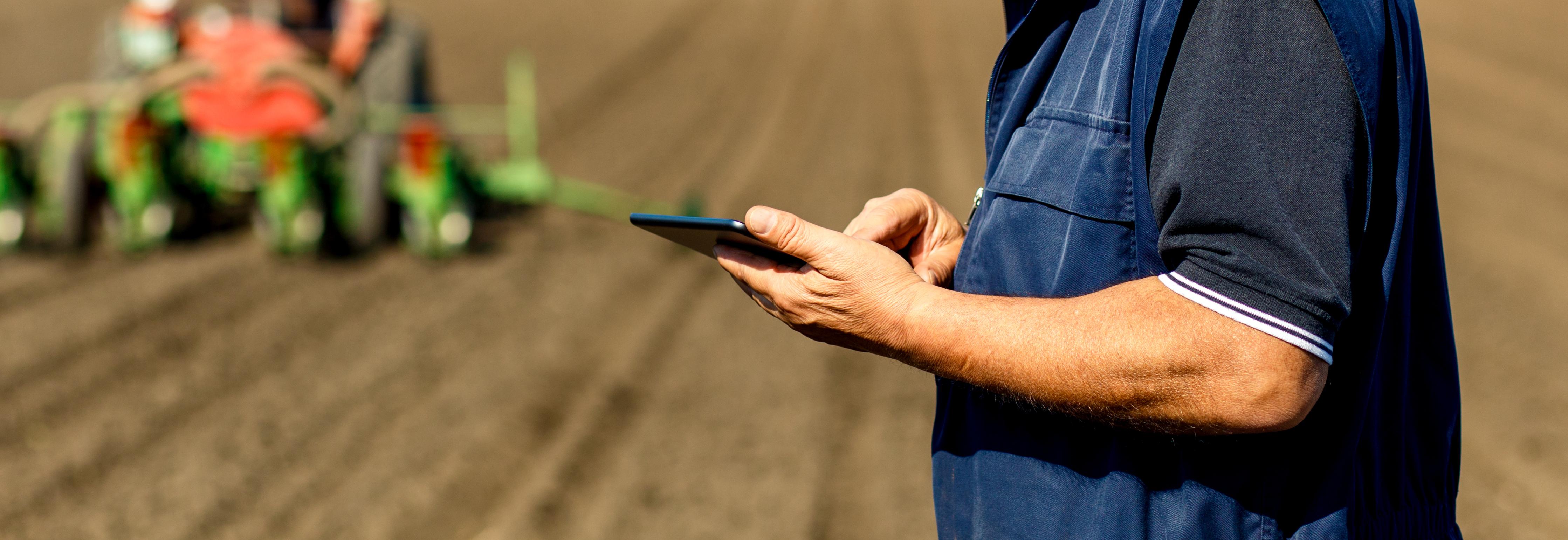 Senior farmer in field examining sowing and holding tablet in his hands © PointImages, Adobe stock