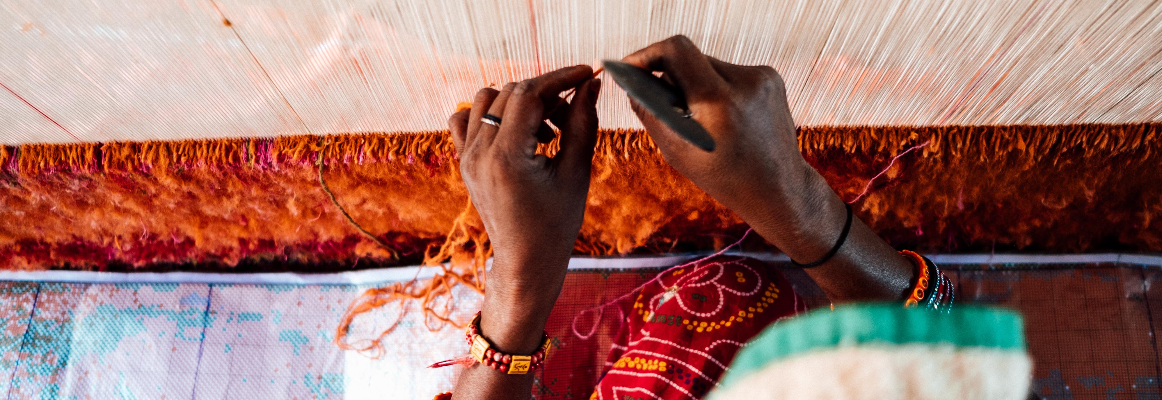 Hands weaving fabric