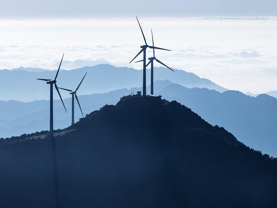 Wind turbines on mountain tops © chungking, Adobe stock
