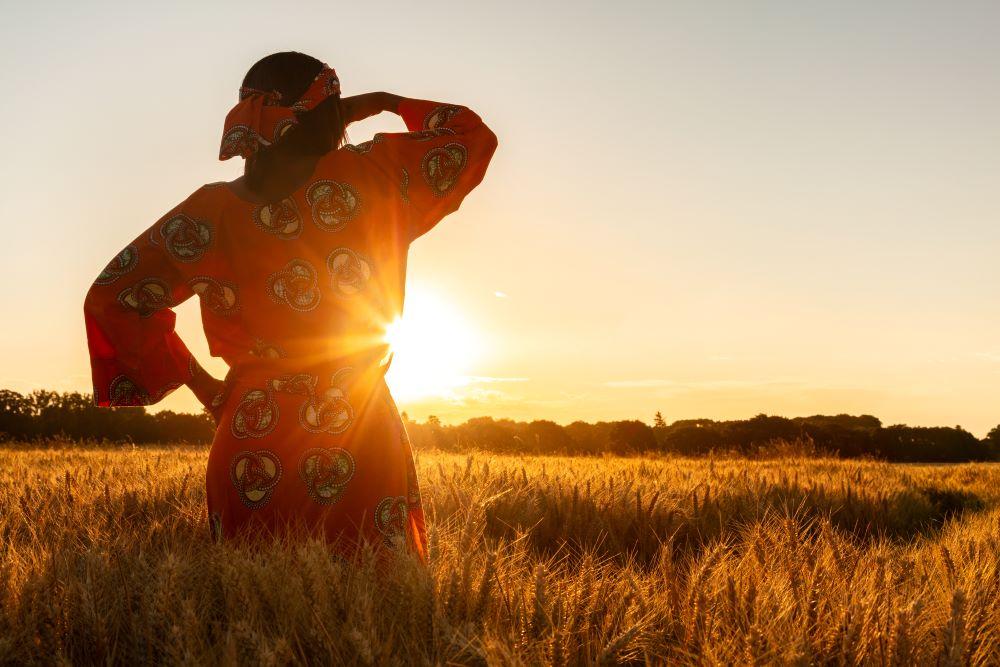 Woman looking to sunset Adobe Stock Images