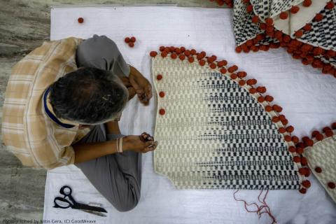 Man weaving on floor_Photographed by Nitin Gera © GoodWeave