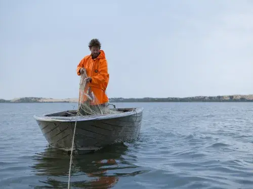 Man skipper fishing on the water in Australia &copy; Randy Larcombe, MSC