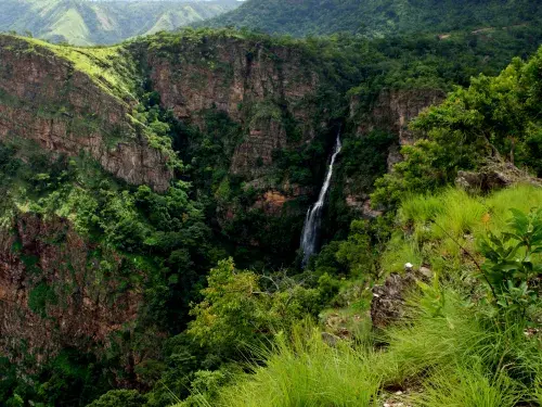 Waterfalls surrounded by lush tropical rainforest in mountainous Volta Region, Ghana