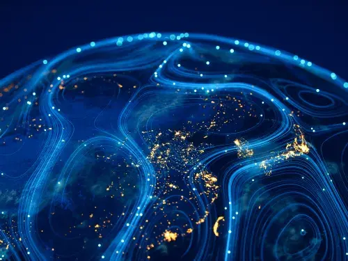 Vector visualisation of the globe using wispy blue lights and sparks of yellow gold