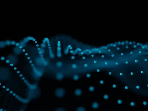 Abstract blue glowing dots forming wave patterns