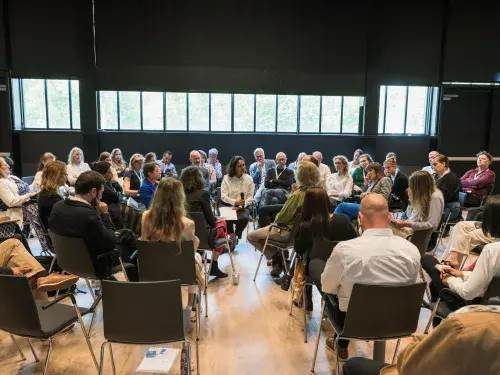 Group of people engaging in a session at the ISEAL Global Sustainability Symposium