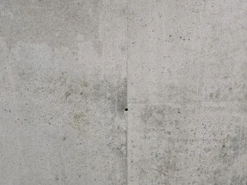 Close-up view of a rough textured concrete wall