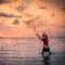 Fisher casting net © Unsplash