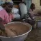 Women of the Tung-Teiya Shea Butter Extraction Women's Association (TUSEWA) make shea butter by hand from roasted shea nuts in Tamale, Ghana, June 23, 2006. Photo: Jonathan Ernst / World Bank. Photo ID: JE-GH060624_33967 World Bank
