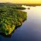 Tree-covered island during sunset