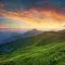 Mountain landscape with pink and orange sunset cloudy sky