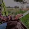 Farmer woman using digital tablet computer in field