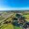 Birds-eyes view of fields and trees in landscape