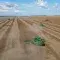 Aerial view of farming machinery harvesting soybeans in Brazil