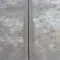 Detailed view of a cracked concrete surface, emphasizing texture and line